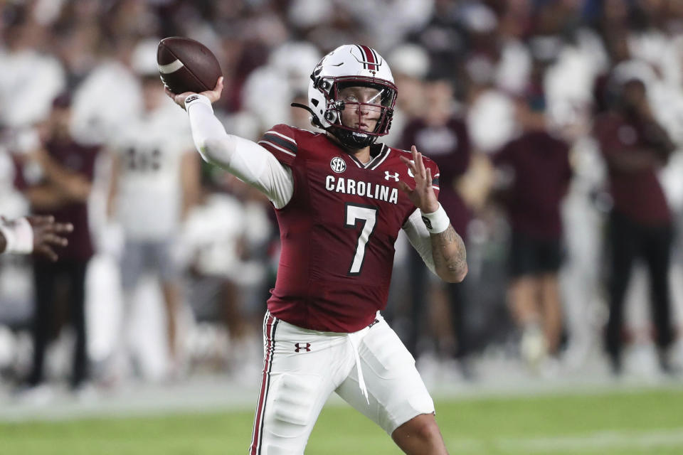 South Carolina quarterback Spencer Rattler (7) has been one of the best QBs in the country this year, but now he faces a tough road test against Tennessee. (AP Photo/Artie Walker Jr.)