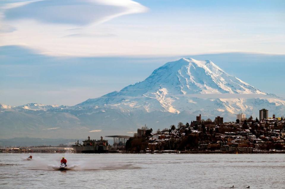 A jet skier cruises through Commencement Bay on Saturday, Jan. 1, 2022, in Tacoma, Wash.