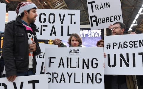 Southern Rail commuters protest at Victoria Station in London over poor rail services - Credit: Andy Rain/EPA