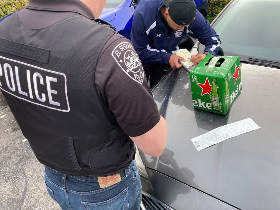 Suspect arrested in Manhattan Beach for allegedly buying alcohol for a minor during a statewide undercover operation.  (California Department of Alcoholic Beverage Control)