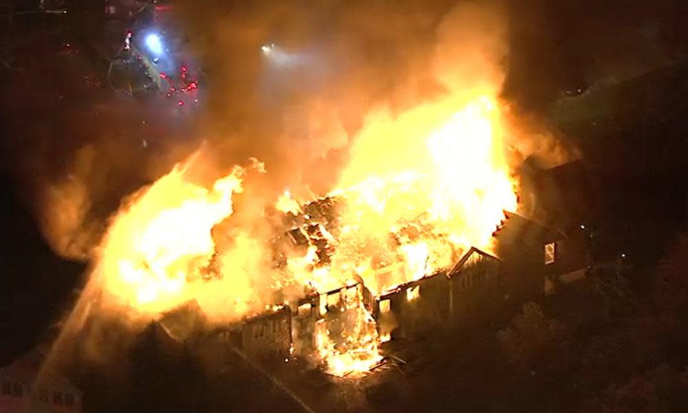 A massive fire burns at the Barclay Friends Senior Living Community in West Chester, Pa.