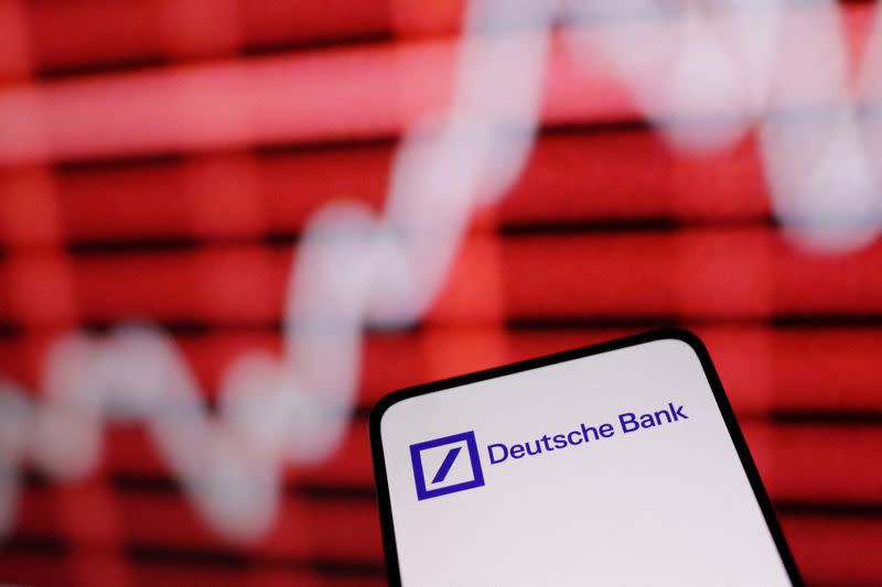 FILE PHOTO: Illustration shows Deutsche Bank logo and rising stock graph