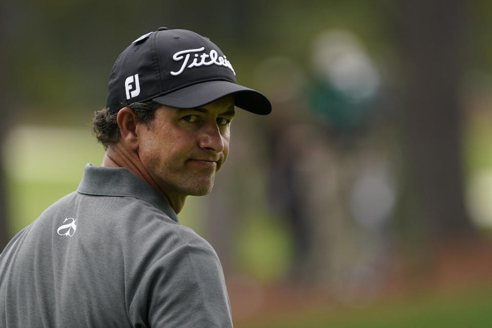 Adam Scott, of Australia, looks back after putting this ball in the water on the 15th hole during the first round of the Masters golf tournament Friday, Nov. 13, 2020, in Augusta, Ga. (AP Photo/David J. Phillip)