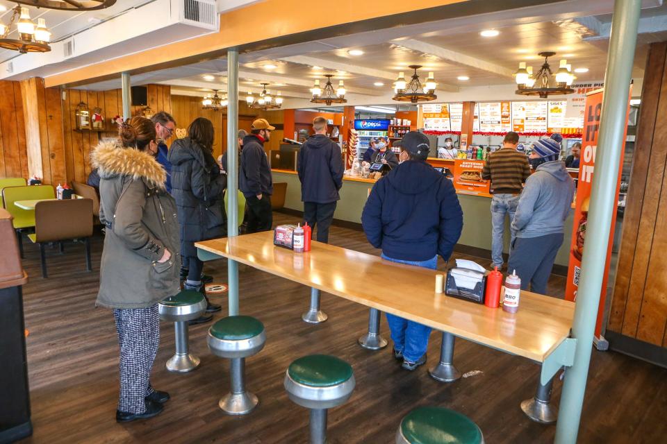 The retro look of Miller's Famous Sandwiches includes swivel stools in East Providence.