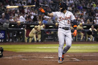 Detroit Tigers' Javier Baez tosses his bat after hitting a grand slam against the Arizona Diamondbacks during the third inning of a baseball game Friday, June 24, 2022, in Phoenix. (AP Photo/Rick Scuteri)