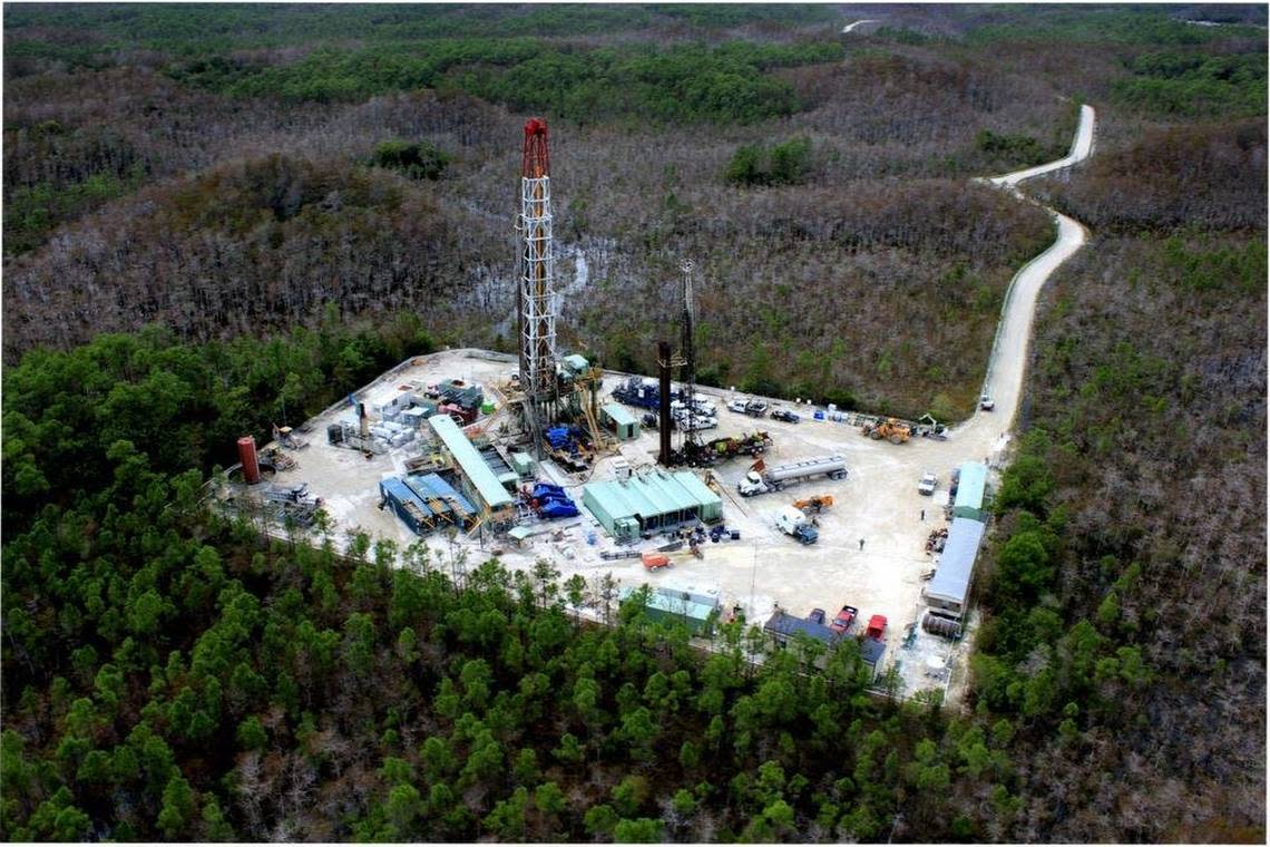 An aerial photo shows one of the existing oil drilling operations in the Big Cypress National Preserve.