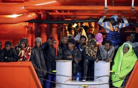 Migrants wait to disembark from tugboat Asso29 in the Sicilian harbour of Pozzallo, southern Italy, May 4, 2015. REUTERS/Antonio Parrinello