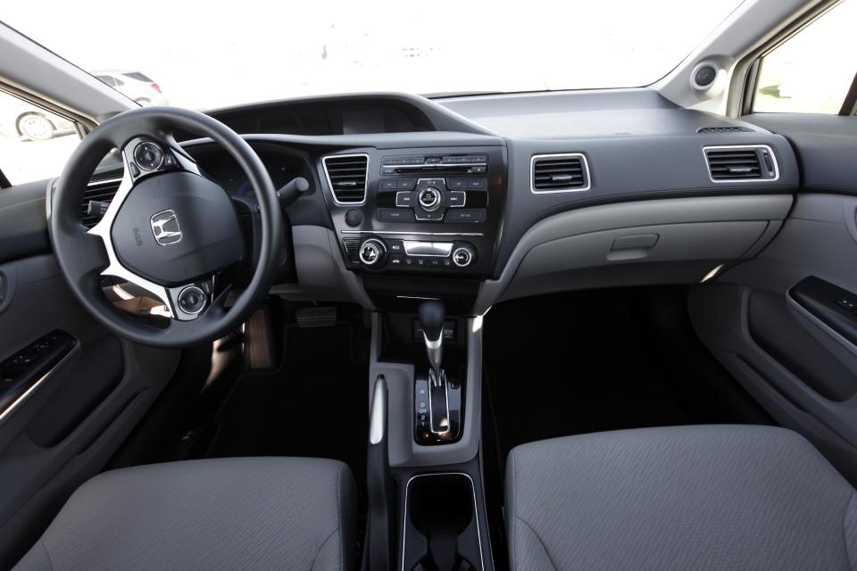 A 2013 Honda Civic interior is shown in Detroit, Tuesday, Nov. 27, 2012. Just 19 months after its Civic compact car hit showrooms and got slammed by critics, the company has revamped the vehicle, giving it a new look and upgrading the interior. (AP Photo/Paul Sancya)