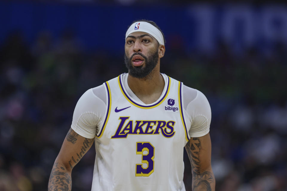 Los Angeles Lakers forward Anthony Davis (3) runs the court during the first half of an NBA basketball game against the Orlando Magic, Saturday, Nov. 4, 2023, in Orlando, Fla. (AP Photo/Gary McCullough)