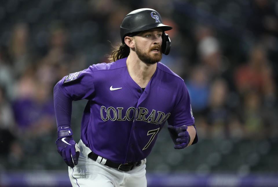 Colorado Rockies' Brendan Rogers heads up the first-base line after flying out against Arizona Diamondbacks relief pitcher Riley Smith in the fifth inning of a baseball game Friday, May 21, 2021, in Denver. (AP Photo/David Zalubowski)