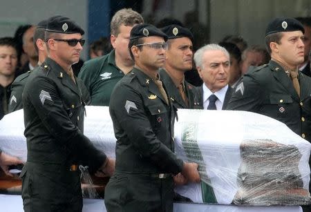 Brazilian President Michel Temer receives the coffin of Chapecoense player Thiaguinho who died on the plane crash in Colombia, in Chapeco, Brazil December 3, 2016. REUTERS/Paulo Whitaker