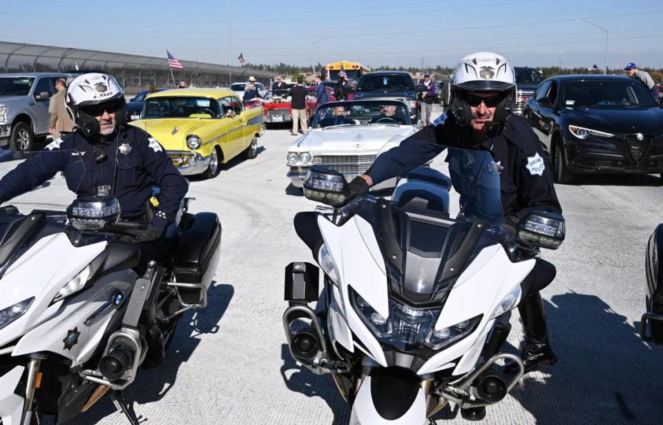 Fresno Police motorcycle officers prepare to lead the parade of vehicles for the opening of Veterans Boulevard Monday, Nov. 20, 2023 in Fresno.