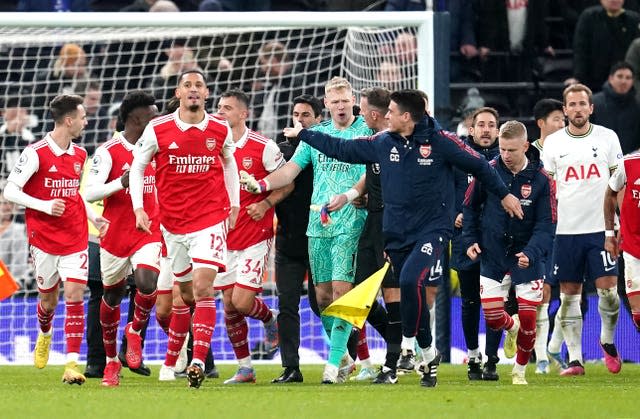 Arsenal goalkeeper Aaron Ramsdale speaks to an assistant referee after an attempt by a fan to kick him after the final whistle (Nick Potts/PA).