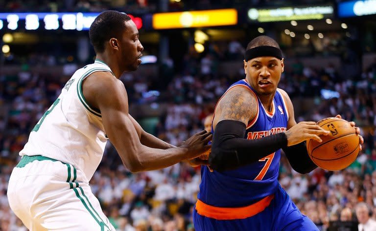 Carmelo Anthony (R) of the New York Knicks drives to the basket in front of Jeff Green of the Boston Celtics on April 26, 2013. Anthony scored 26 points as the Knicks cruised to a 90-76 victory for a commanding 3-0 lead in their NBA Eastern Conference first-round playoff series