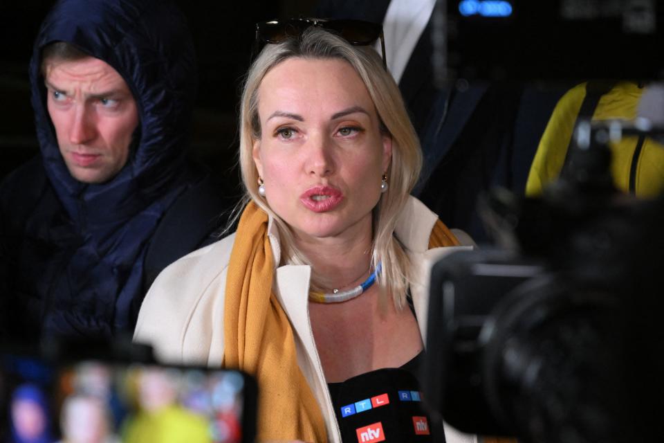 Marina Ovsyannikova, the editor at the state broadcaster Channel One who protested against Russian military action in Ukraine during the evening news broadcast at the station late Monday, speaks to the media as she leaves the Ostankinsky District Court after being fined for 30,000 rubles ($280, 247 euros) for breaching protest laws in Moscow on March 15, 2022.  / AFP / -