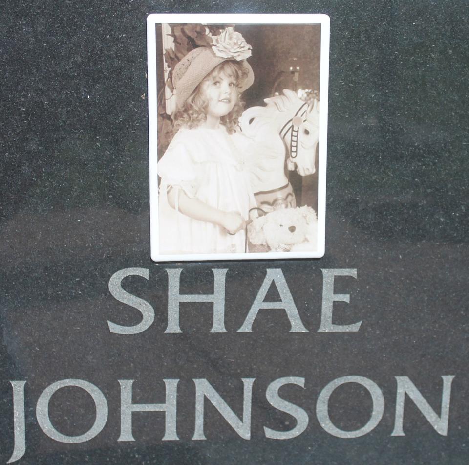 A photo of Shae Johnson is on a monument at Webbers Falls Memorial Park.