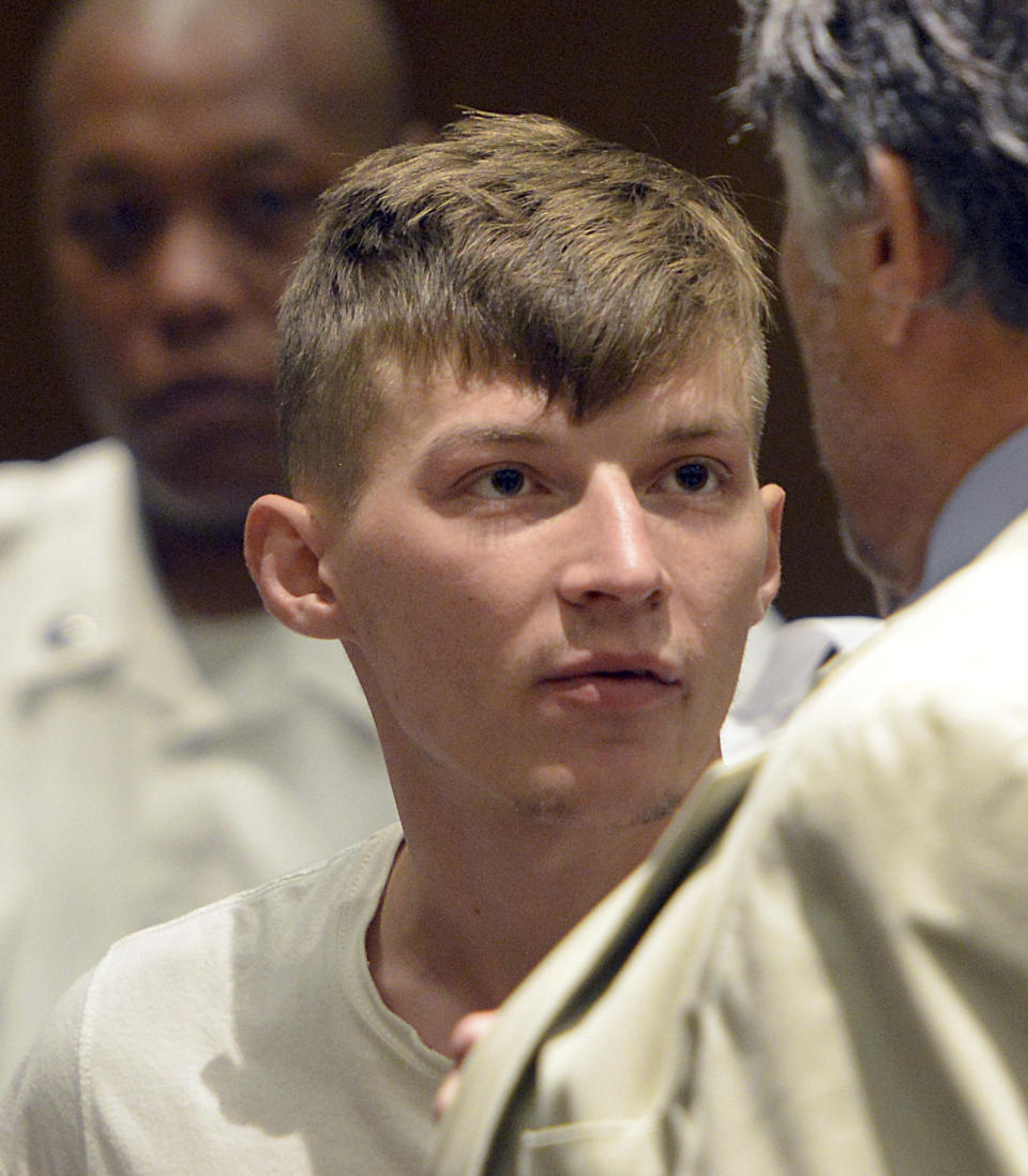 CORRECTS TO SPRINGFIELD NOT HAMPTON DISTRICT COURT - Volodymyr Zhukovskyy, 23, of West Springfield, stands during his arraignment in Springfield District Court, Monday, June 24, 2019, in Springfield, Mass. Zhukovskyy, the driver of a truck in a fiery collision on a rural New Hampshire highway that killed seven motorcyclists, was charged Monday with seven counts of negligent homicide. (Don Treeger/The Republican via AP, Pool)