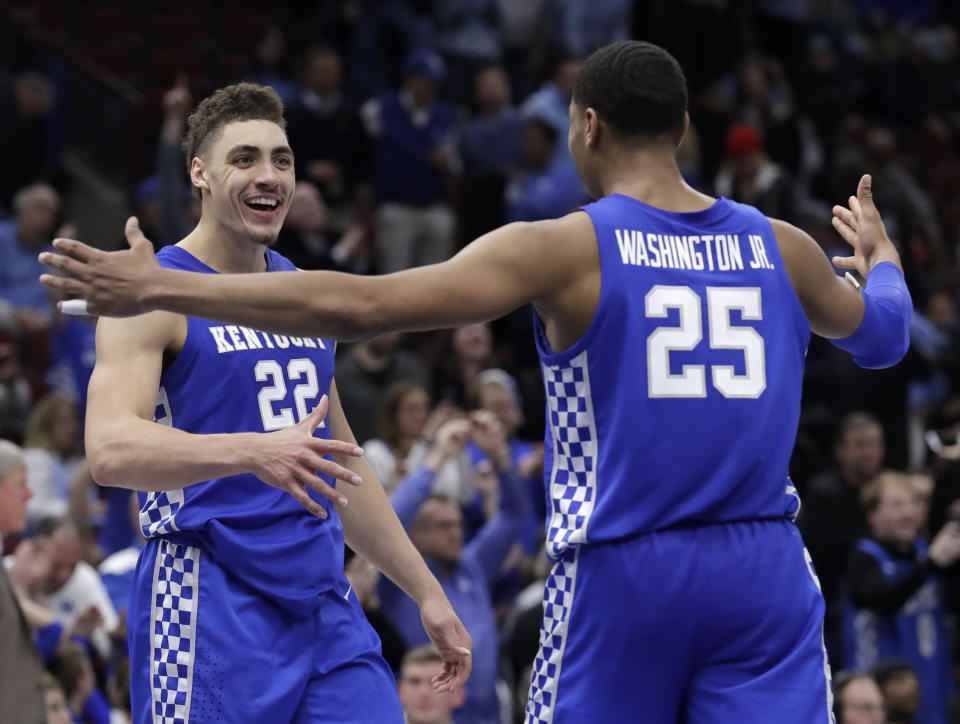 Kentucky forward Reid Travis, left, celebrates with forward PJ Washington Jr., after their team defeated North Carolina in an NCAA college basketball game in the fifth annual CBS Sports Classic, Saturday, Dec. 22, 2018, in Chicago. (AP Photo/Nam Y. Huh)