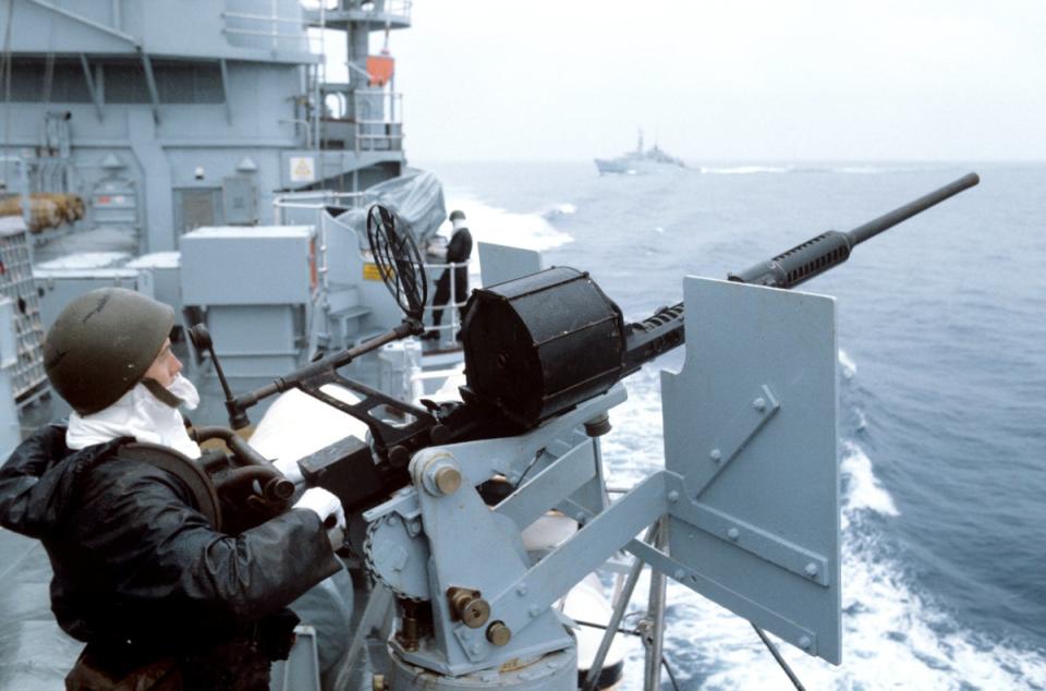 A Royal Navy sailor manning an anti-aircraft gun aboard HMS Hermes as the British Taskforce sails south to the Falkland Islands (PA) (PA Archive)