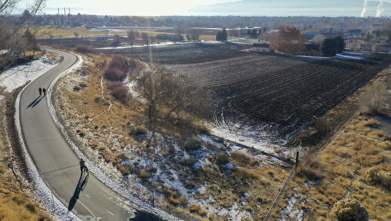 People walk and bike on the Murdock Canal Trail in Lindon on Dec. 21, 2020. A new legislative proposal would turn old canals into transportation access and recreation areas.