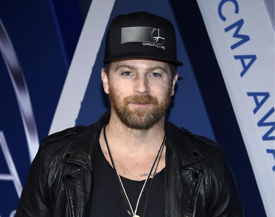 FILE - This Nov. 8, 2017 file photo shows Kip Moore at the 51st annual CMA Awards in Nashville, Tenn. Moore was used to traveling the world to surf, rock climb or hike, but lately he's been isolating himself in a remote lodge in eastern Kentucky. The Georgia-born artist releases his new album “Wild World,” in a very chaotic time, but he said his introspective messages might help people right now. (Photo by Evan Agostini/Invision/AP, File)