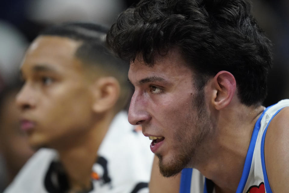 Oklahoma City Thunder forward Chet Holmgren, right, looks on from the bench in the first half during an NBA Summer League basketball game against the Utah Jazz, Monday, July 3, 2023, in Salt Lake City. (AP Photo/Rick Bowmer)