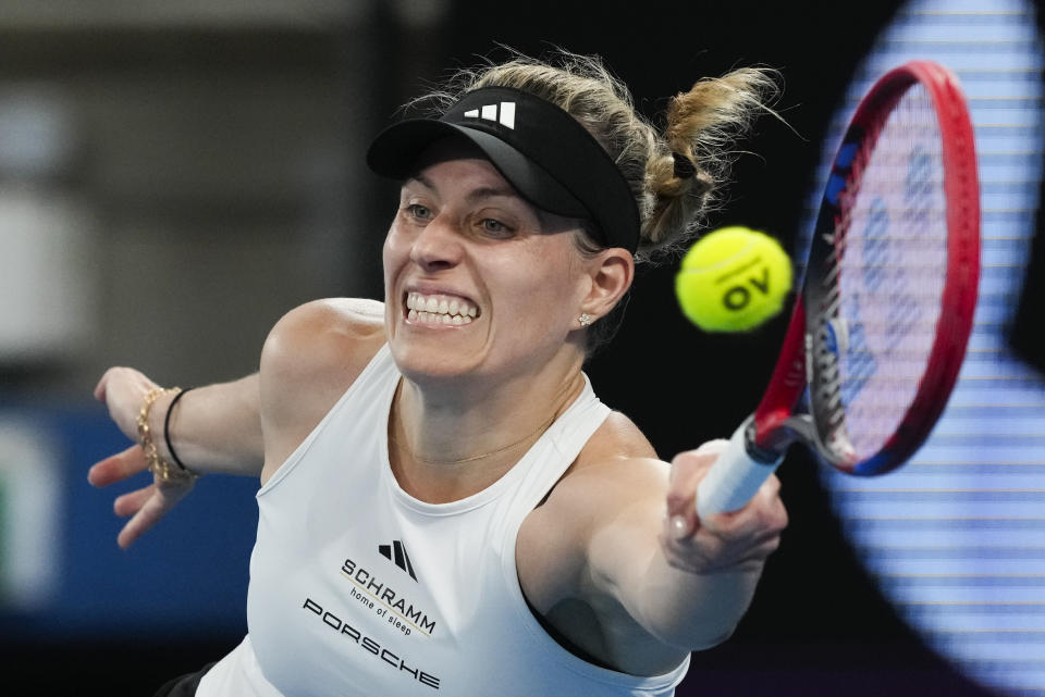 FILE - Germany's Angelique Kerber plays a forehand return to Australia's Ajla Tomljanovic during their United Cup semifinal tennis match in Sydney, Australia, Saturday, Jan. 6, 2024. The first 15-day Australian Open sets to start Sunday morning, Jan. 14. (AP Photo/Mark Baker,File)
