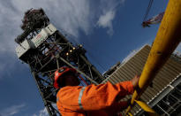 An employee works on at the Centenario deep-water oil platform in the Gulf of Mexico off the coast of Veracruz, Mexico January 17, 2014. REUTERS/Henry Romero