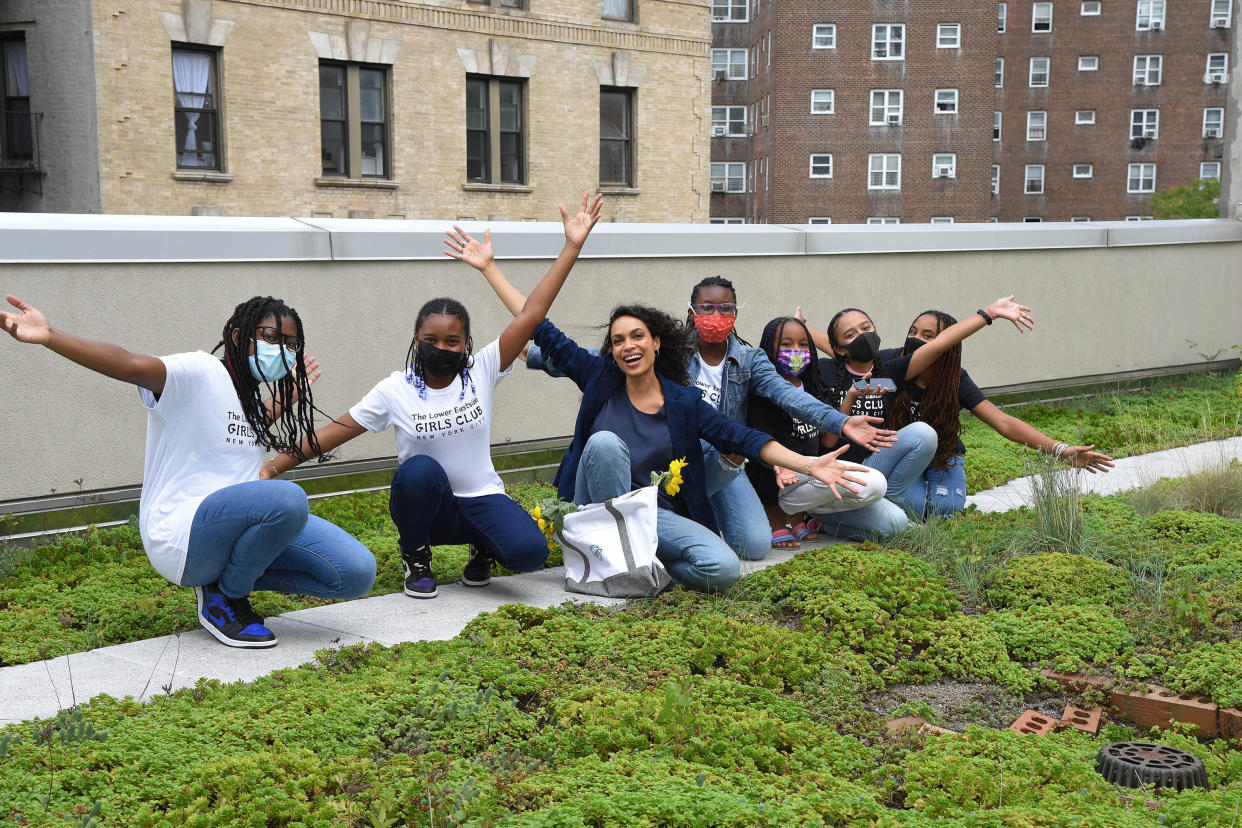 Rosario Dawson is all smiles with girls from The Lower Eastside Girls Club in New York City (Credit: Michael Simon) 