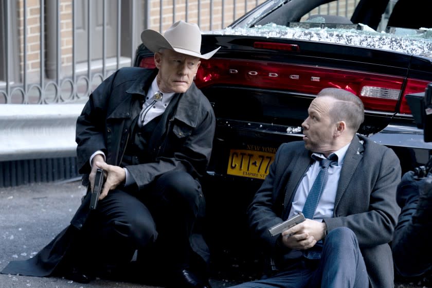 Blue Bloods -- CBS TV Series, "Fog of War" -- Danny and Baez work with Texas Ranger Waylon Gates (Lyle Lovett) when they are put on a case to find the Lone Star Killer. Also, after Eddie\'s partner, Officer James Addison (Justin Cunningham), mistakenly shoots an undercover cop, internal affairs accuses Jamie of not supervising properly, and Frank speaks with Officer Addison about why he shouldn\'t turn in his shield, on BLUE BLOODS, Friday, Feb. 14 (10:00-11:00 PM, ET/PT) on the CBS Television Network. Pictured: Donnie Wahlberg as Danny Reagan , Lyle Lovett as Texas Ranger Waylon Gates. Photo: Patrick Harbron/CBS ©2020 CBS Broadcasting Inc. All Rights Reserved. Lyle Lovett, left, and Donnie Wahlberg in "Blue Bloods" on CBS.