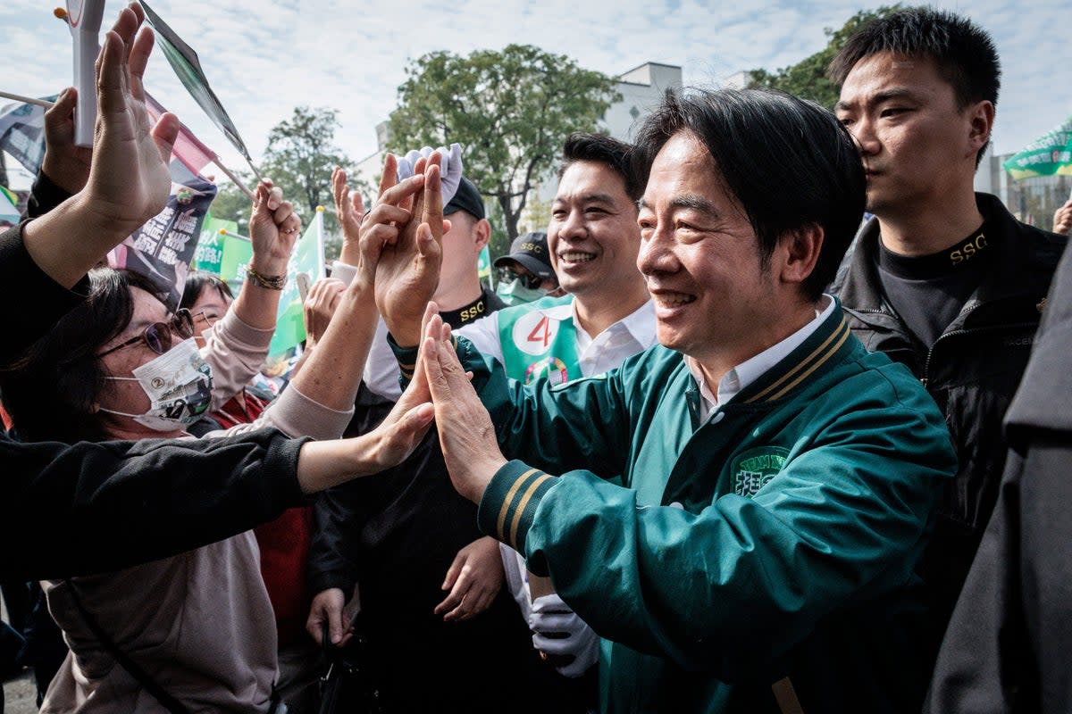 Lai Ching-te greets supporters duringa campaign stop in Kaohsiung (AFP/Getty)