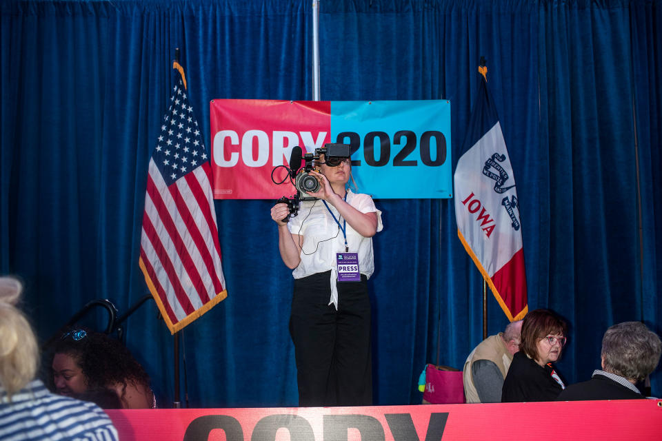 A journalist records video before remarks by Senator Cory Booker in the Grand Ballroom of the Double Tree Cedar Rapids Convention Complex during the Democratic Hall of Fame event in Cedar Rapids, Iowa on June 9. | Danny Wilcox Frazier—VII for TIME