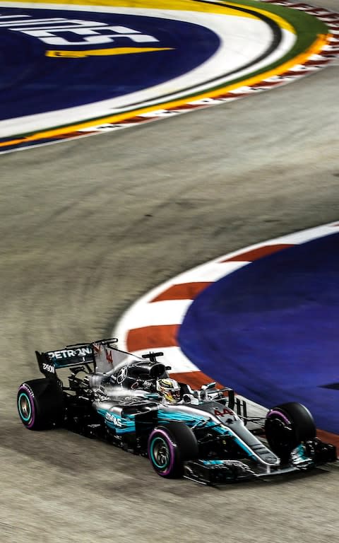 Lewis Hamilton takes the bend - Credit: EPA