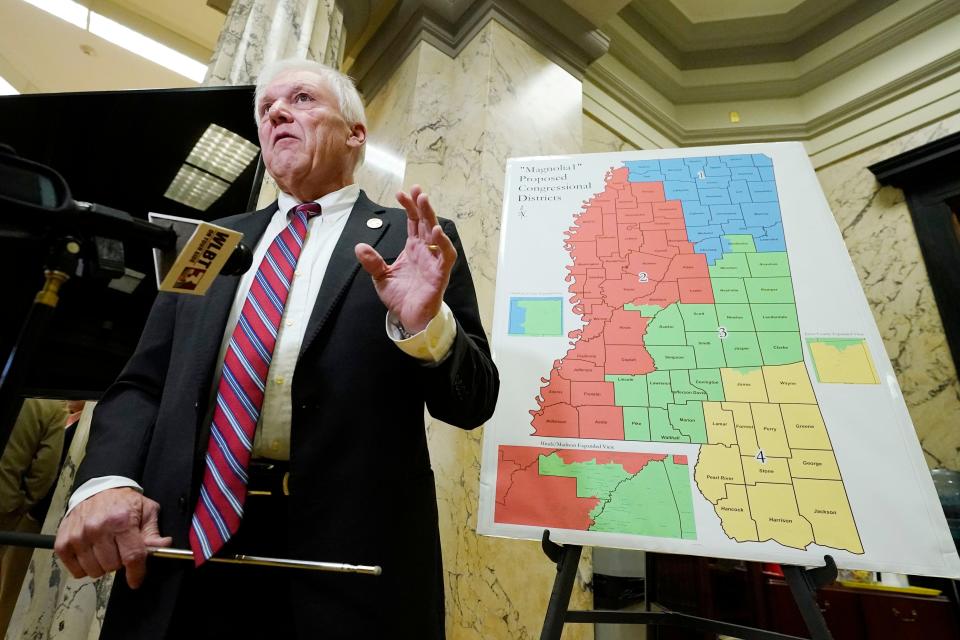 Joint Congressional Redistricting and Legislative Reapportionment Committees chairman Rep. Jim Beckett, R-Bruce, stands before a poster of the "Magnolia 1" proposed congressional plan, and explains the process involved in determining the congressional boundaries following the meeting at the Capitol, during which the committees approved its final proposal for Congressional redistricting, Wednesday, Dec. 15, 2021, in Jackson, Miss.