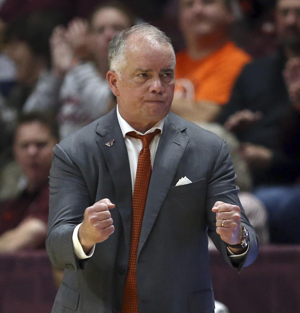 Virginia Tech head coach Mike Young celebrates a 3-point basket by Hunter Cattoor against Lehigh during the first half of an NCAA college basketball game Thursday, Nov. 10, 2022, in Blacksburg, Va. (Matt Gentry/The Roanoke Times via AP)