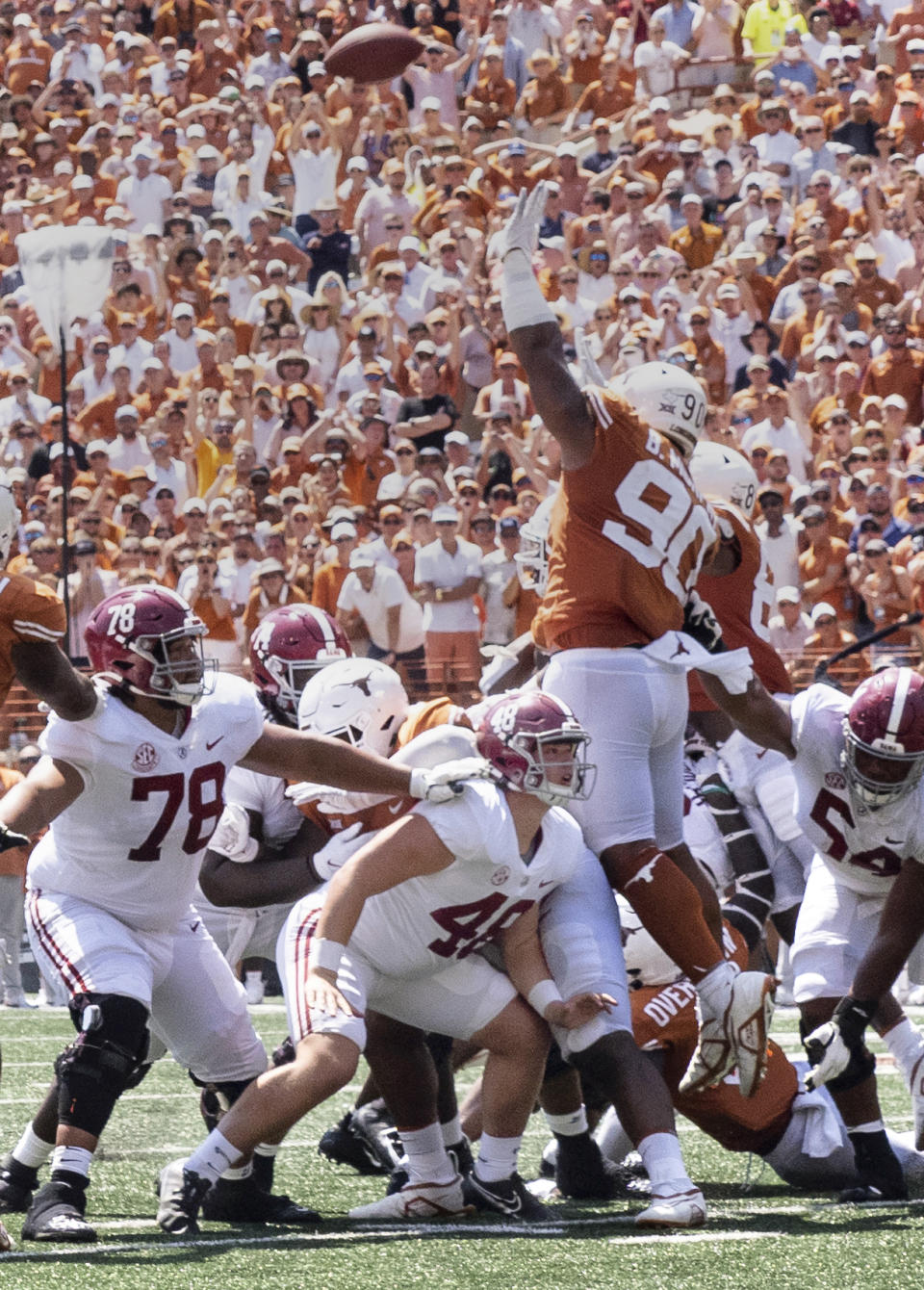 FILE - Alabama long snapper Kneeland Hibbett (48) blocks on the line of scrimmage on the winning field goal during the second half the team's NCAA college football game against Texas, on Sept. 10, 2022. Hibbett, the grandson of former Alabama football player Dennis Homan, has pledged to donate a share of his name, image and likeness proceeds to the Concussion Legacy Foundation, which has worked with ex-football players and others who developed traumatic brain injuries from repeated hits to the head. (AP Photo/Michael Thomas, File)