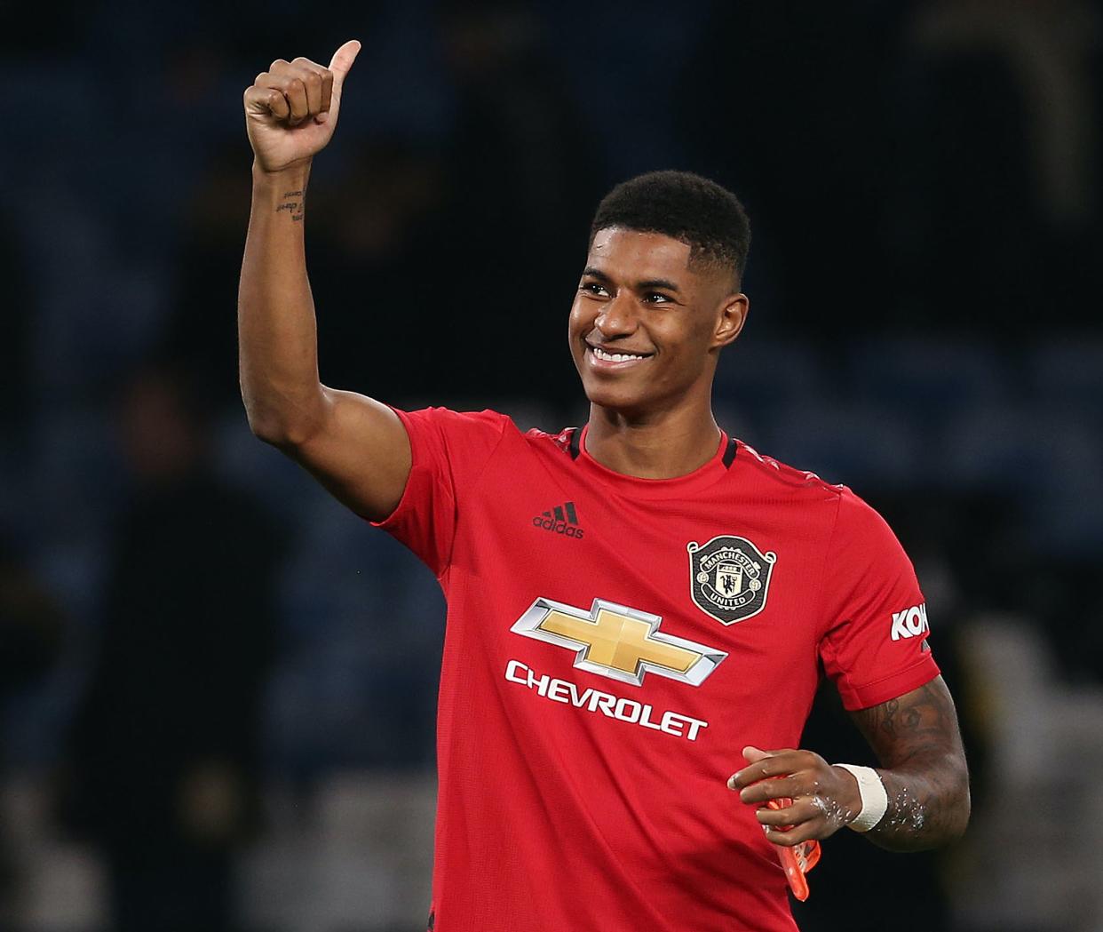 <p>Manchester United striker Marcus Rashford will help to distribute books to under-privileged children</p> (Manchester United via Getty Images)