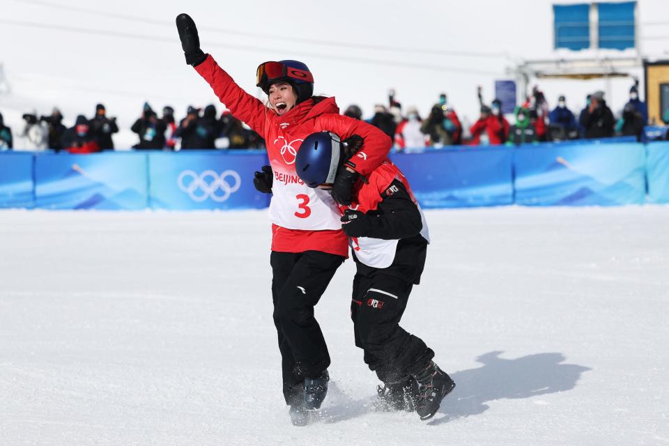 Gold medallist Mathilde Gremaud of Team Switzerland (R) and Silver medallist Ailing Eileen Gu of Team China react after winning their medals during the Women&#39;s Freestyle Skiing Freeski Slopestyle Final on Day 11 of the Beijing 2022 Winter Olympics.