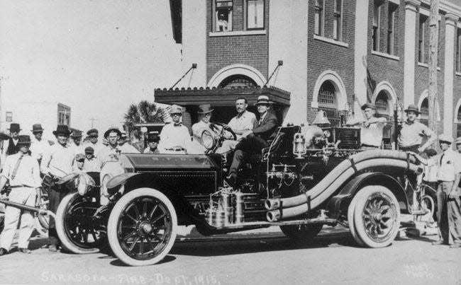 Newly appointed Sarasota Mayor A.B. Edwards, right, alongside Fire Chief Henry Behrens in front of John Ringling’s Sarasota Bank at Five Points, ca. 1915.