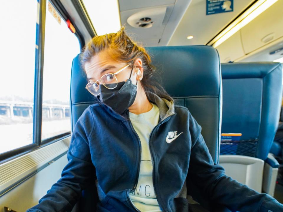 The author sits in first class on an Amtrak Acela train