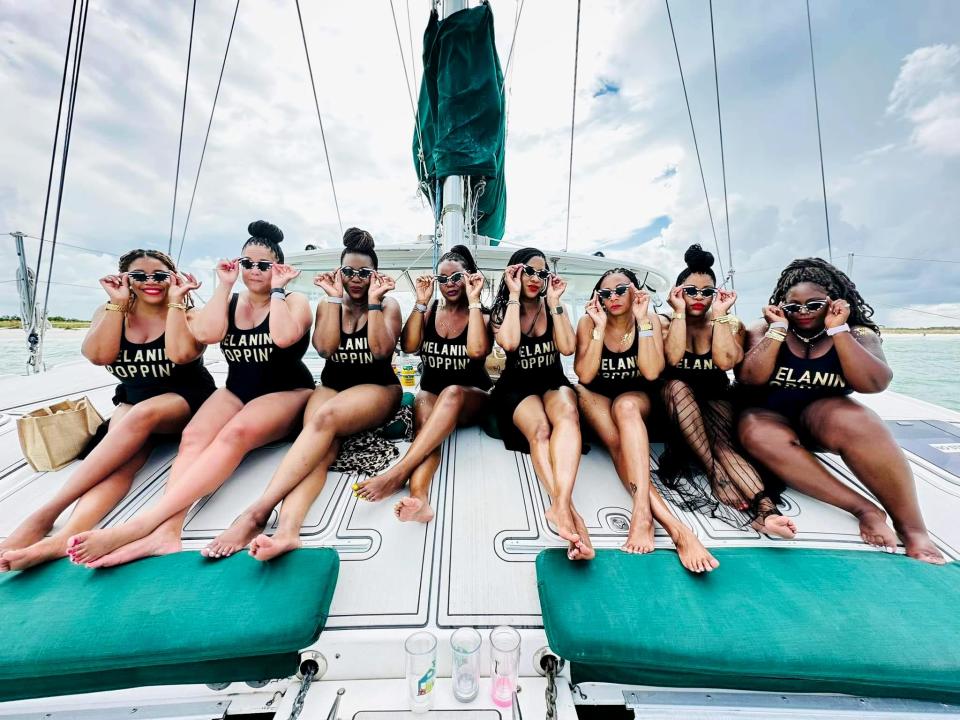 (Left to right) Cheryl Steward, Erin Jones, LaShina Mitchell, April Lynn Fisher, Coronda Raven, Bianca Porter, Felicia Graham and Candice Gadsden on a boat with Catamaran Cruise at the JW Marriot of Marco Island Beach Resort in Florida on their recent vacation.   