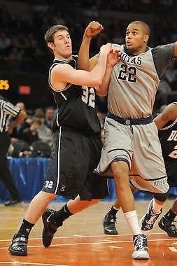 Former Edgewood star and Butler forward Garrett Butcher tries to keep Pittsburgh’s Julian Vaugn (22) from the basket in the Jimmy V Classic at Madison Square Garden in December of 2009.