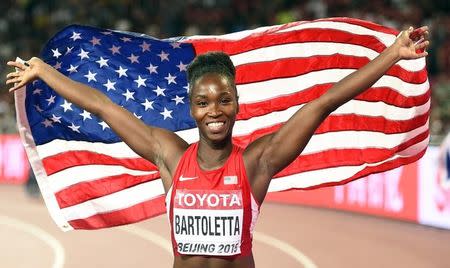 Tianna Bartoletta of the U.S. celebrates after winning gold in the women's long jump final during the 15th IAAF World Championships at the National Stadium in Beijing, China August 28, 2015. REUTERS/Dylan Martinez