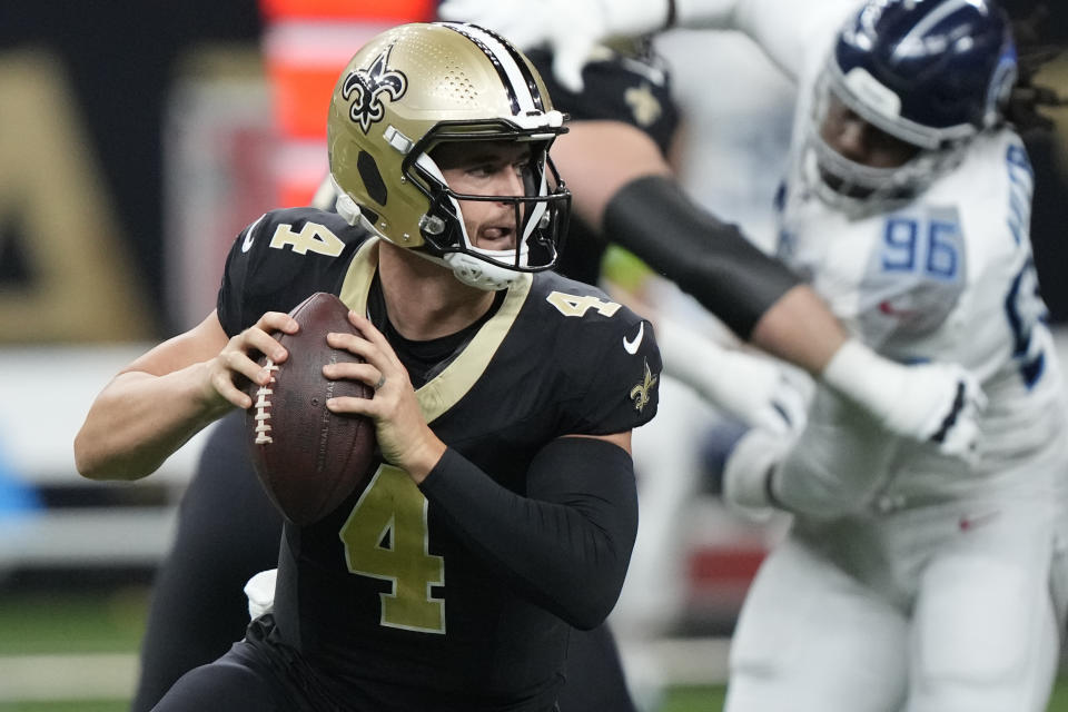 New Orleans Saints quarterback Derek Carr (4) looks to throw a pass against the Tennessee Titans in the first half of an NFL football game in New Orleans, Sunday, Sept. 10, 2023. (AP Photo/Gerald Herbert)