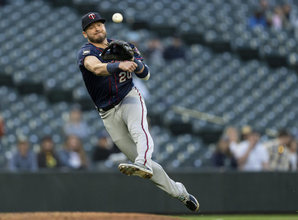 Minnesota Twins third baseman Josh Donaldson throws to first base for the out on a ball hit by Seattle Mariners' Ty France during the fourth inning of a baseball game Tuesday, June 15, 2021, in Seattle. (AP Photo/Stephen Brashear)