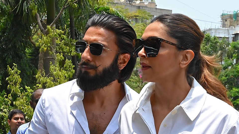 Bollywood actors Ranveer Singh and Deepika Padukone arrive to cast their vote at a polling station in Mumbai on May 20, 2024. - Sujit Jaiswal/AFP/Getty Images