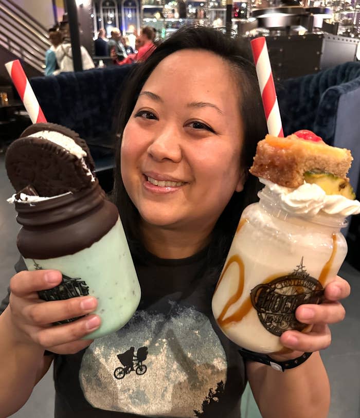 Holding two giant milkshakes bigger than my head