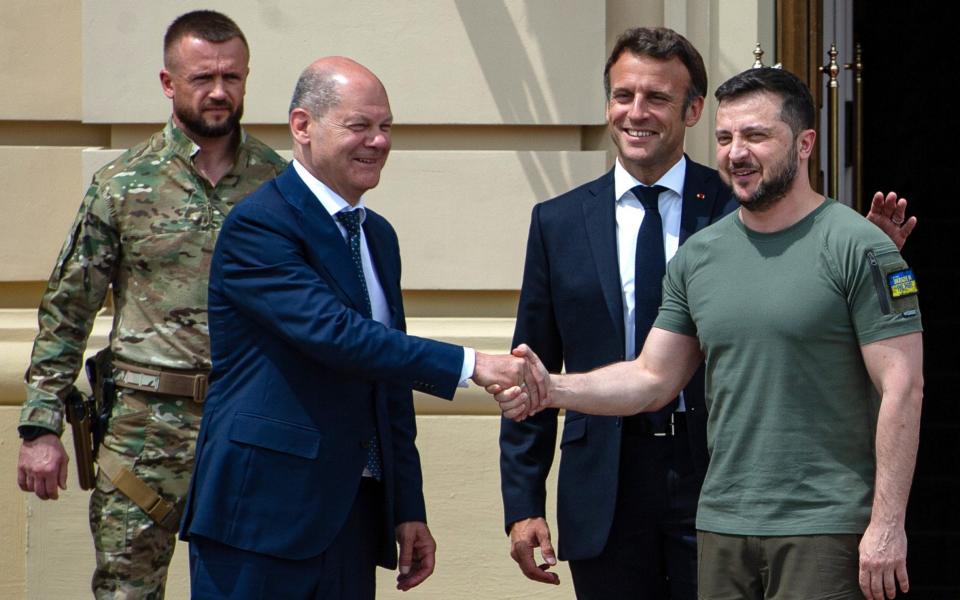 President Volodymyr Zelensky shakes hands with German Chancellor Olaf Scholz - Getty Images