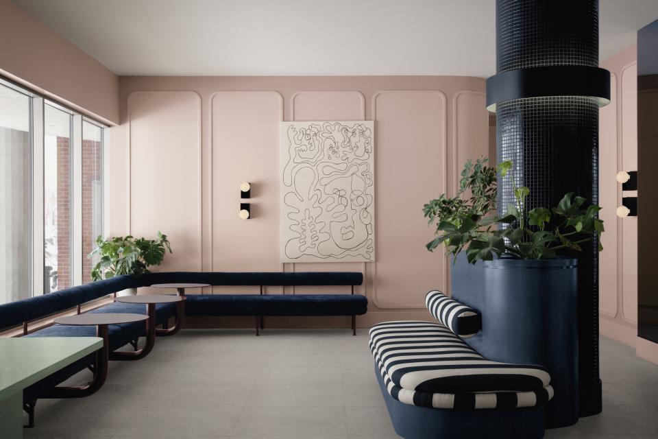 pink lobby with curved wall panels