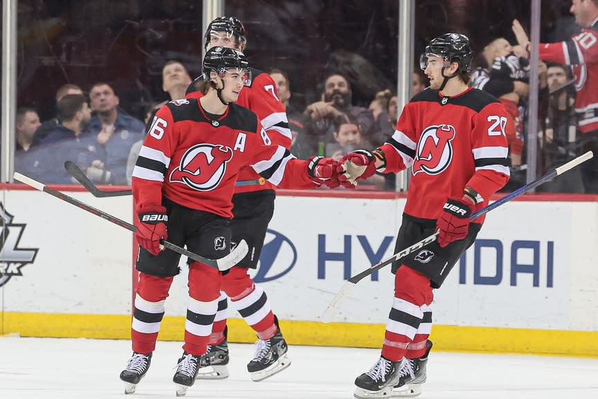 New Jersey Devils center Jack Hughes (86) celebrates his goal with center Michael McLeod (20) during the first period against the Columbus Blue Jackets at Prudential Center.
